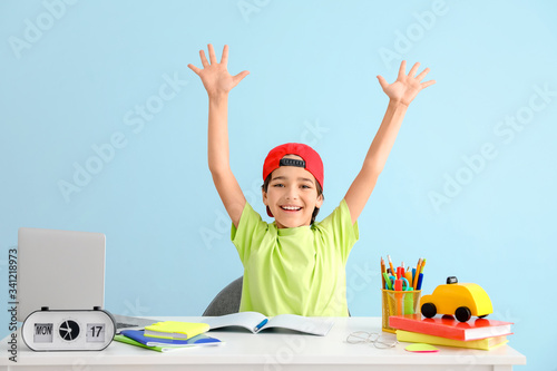 Happy little boy doing home...