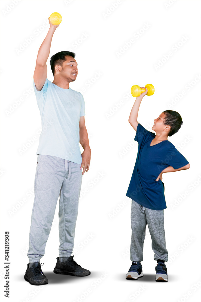 Young father and little son lifting dumbbell