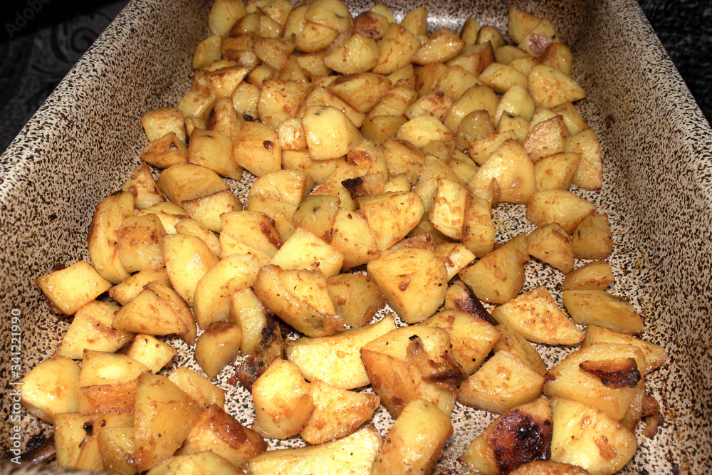 baked potatoes on a baking sheet baked potatoes on a baking sheet