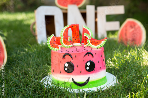 strawberry cake on the green lawn one year of birth