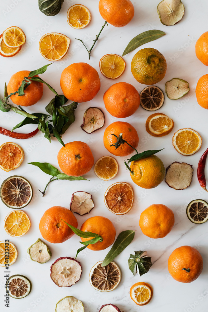 Dried oranges and clementines on a marble countertop Dried oranges and clementines on a marble countertop