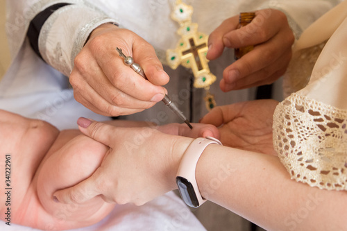 Christening the baby at the Orthodox church