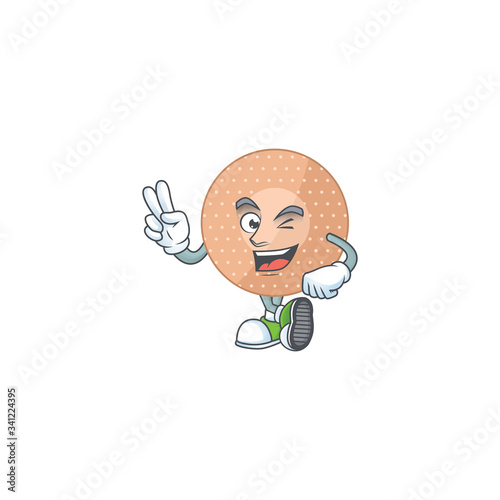 Cheerful rounded bandage mascot design with two fingers © kongvector