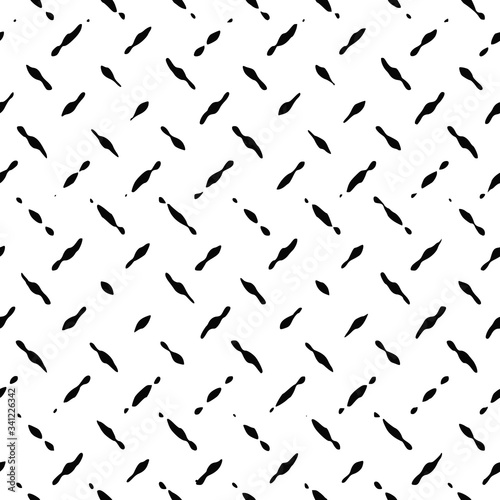 Seamless pattern. Black dashes on a white background, diagonal structure.