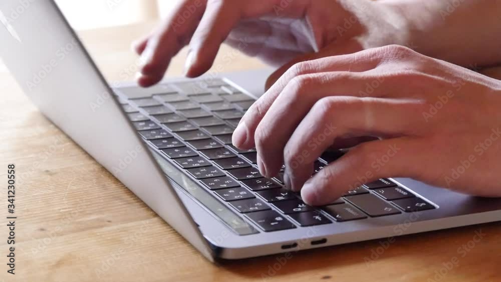 Freelance man working from home. Close up hand with laptop. Freelance man working from home. Close up hand with laptop.