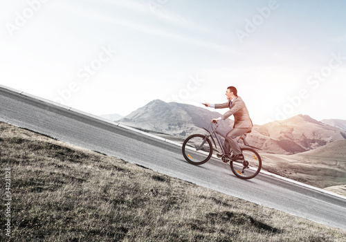 Businessman with paper documents in hand photo