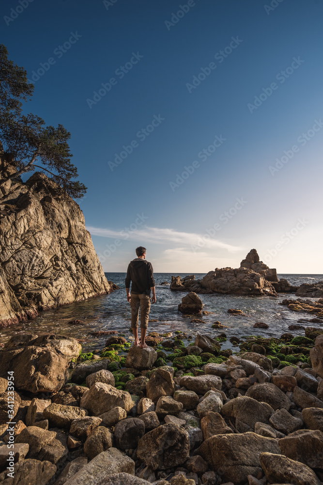 man on rocks  beach
