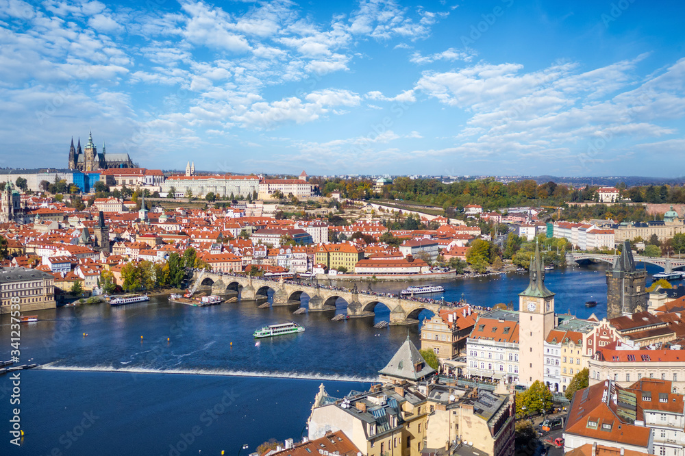 Beautiful aerial view to the famous Charles Bridge and Castle on top of the Mala Strana district in Prague, Czech Republic, during a sunny day