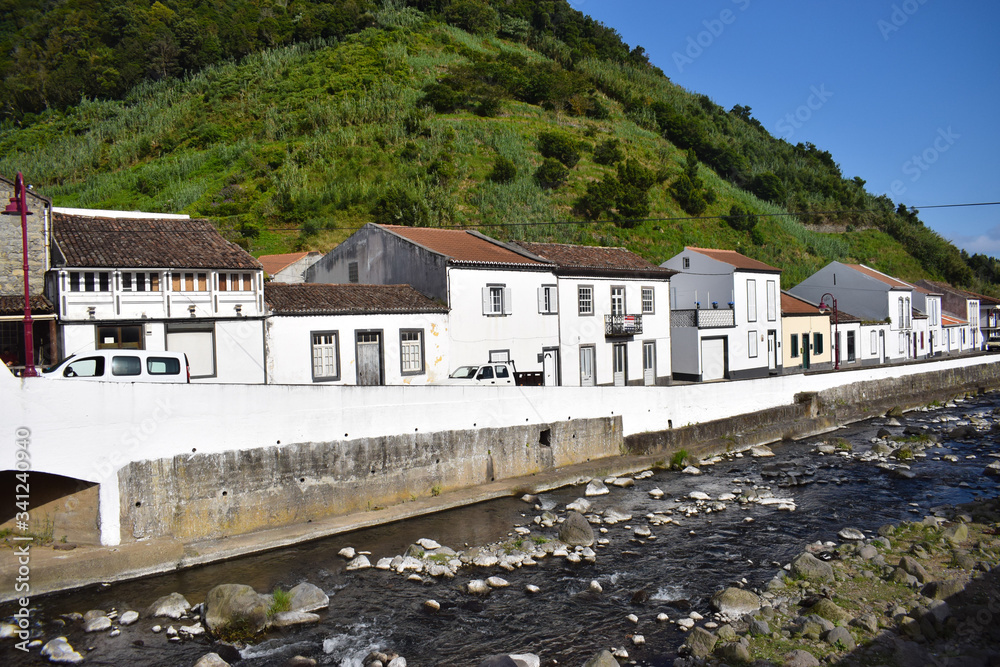 Empty streets in Portugal due to coronavirus. Azorean islands, small town with white houses by the river