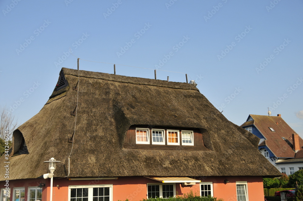 thatched roof in northern germany with blue sky thatched roof in northern germany with blue sky