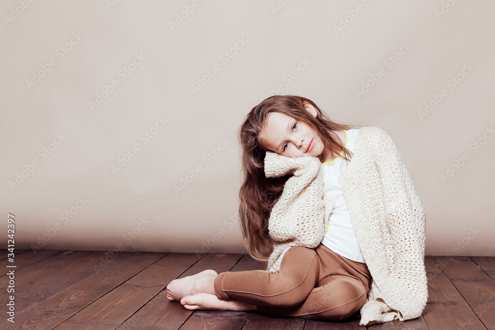 little girl sitting on the floor and sad little girl sitting on the floor and sad