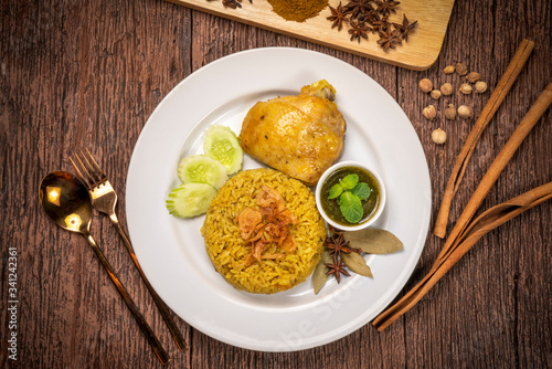 Delicious spicy chicken biryani on rustic wooden background, Chicken Biryani Thai style
