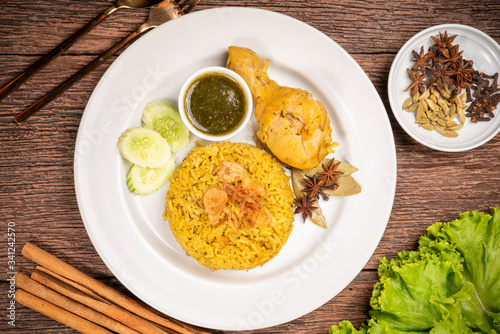 Delicious spicy chicken biryani on rustic wooden background, Chicken Biryani Thai style