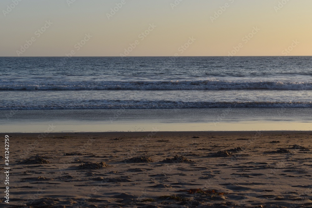 Ocean waves gently roll onto shore Ocean waves gently roll onto shore