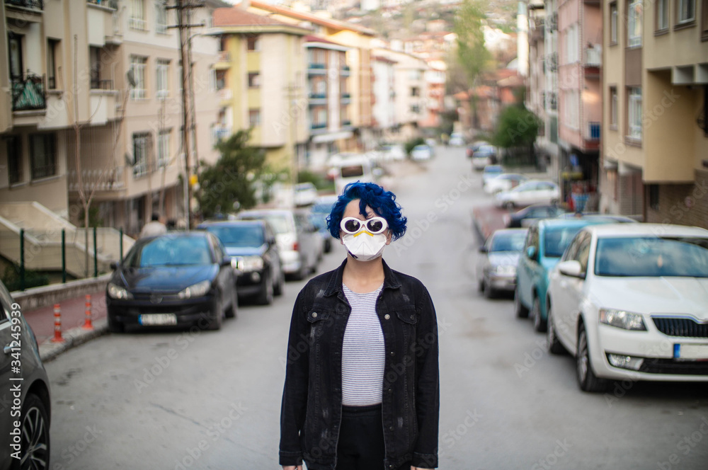 Blue Haired Girl in Streets, Wearing a Mask to Protect from The Virus