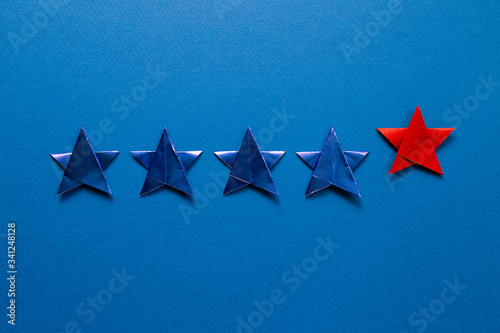 Fototapeta Naklejka Na Ścianę i Meble -  Five stars quality rating on blue background