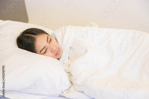 Beautiful woman sleeping on white pillow