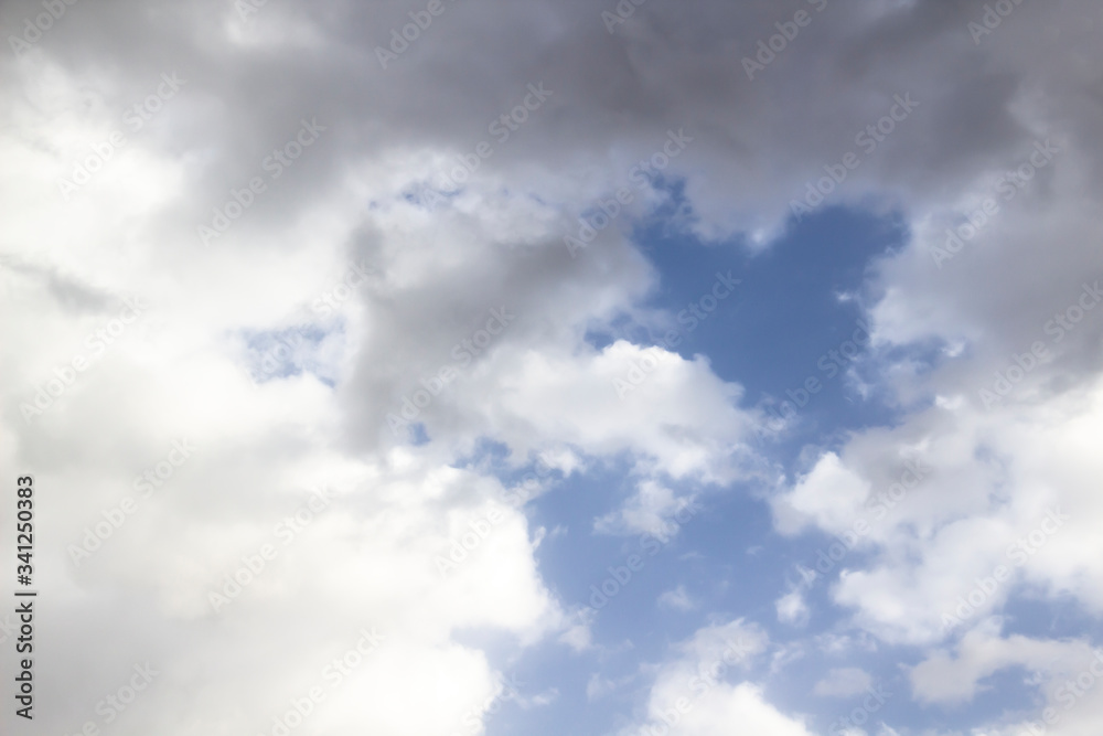 Obraz premium Clouds in the blue sky. A beautiful clouds against the blue sky background. Beautiful cloud pattern in the sky.