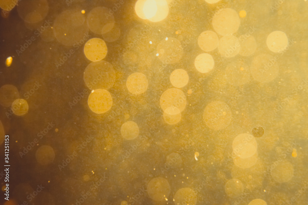 Dark Abstract Gold bokeh sparkle on black Dark Abstract Gold bokeh sparkle on black