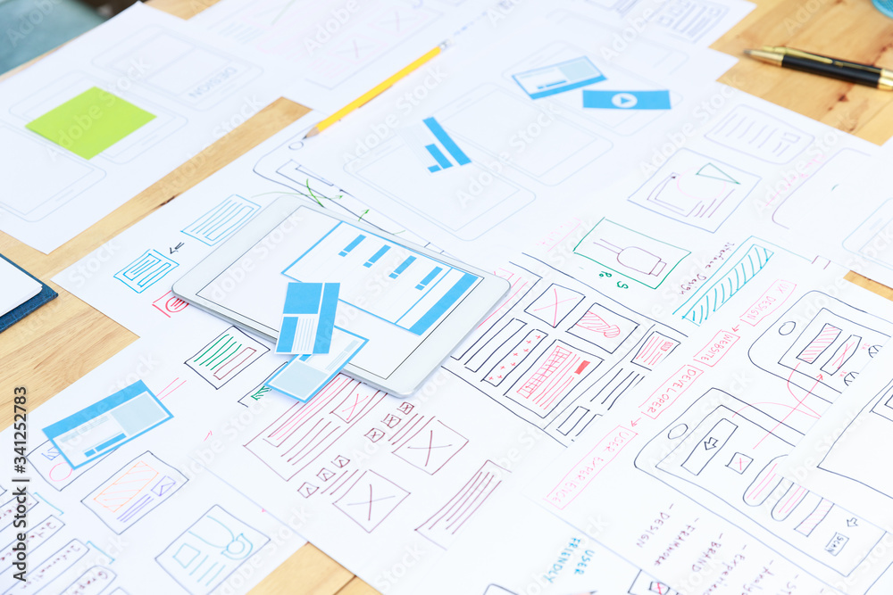Graphic designers work together with UX UI designer planning application template layout framework for mobile phone computer mobile Graphic designers work together with UX UI designer planning application template layout framework for mobile phone computer mobile