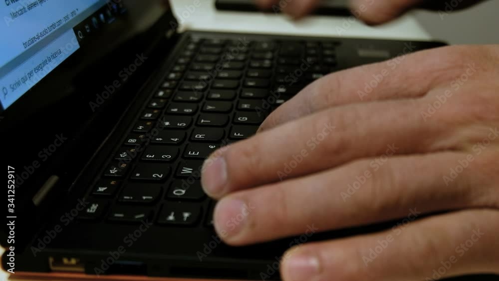 Man Tiping On A Mechanical Black pc Keyboard while working on web business Man Tiping On A Mechanical Black pc Keyboard while working on web business