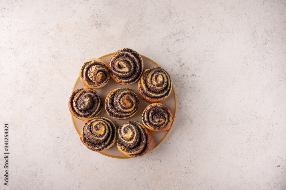 Homemade sweet buns with poppy seed on white background Homemade sweet buns with poppy seed on white background