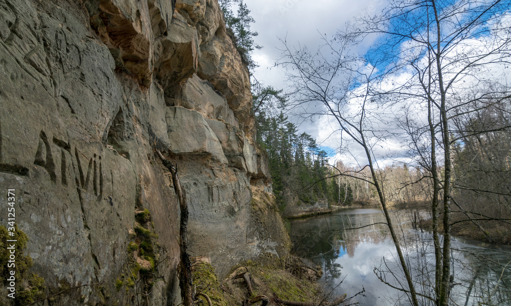 landscape with sandstone cliff on the river bank