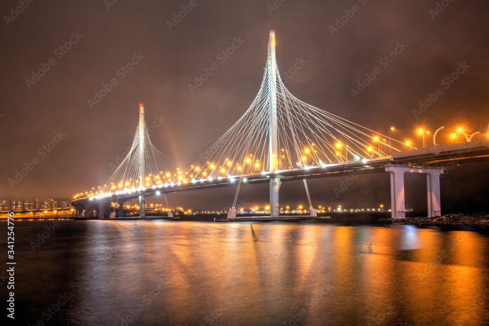 Obraz premium St. Petersburg, Russia - View of the night cable-stayed bridge in St. Petersburg. Illuminated night bridge