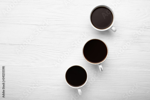 Three white coffee cups wit...