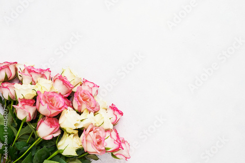 Bouquet of pink and white roses on light background. Mothers day, Valentines Day, Birthday celebration concept. Greeting card. Copy space, top view