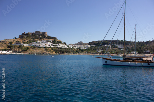 Lindos Village in Rhodes, Greece - 07/07/2018 : view of a yacht in the sea. © Irida