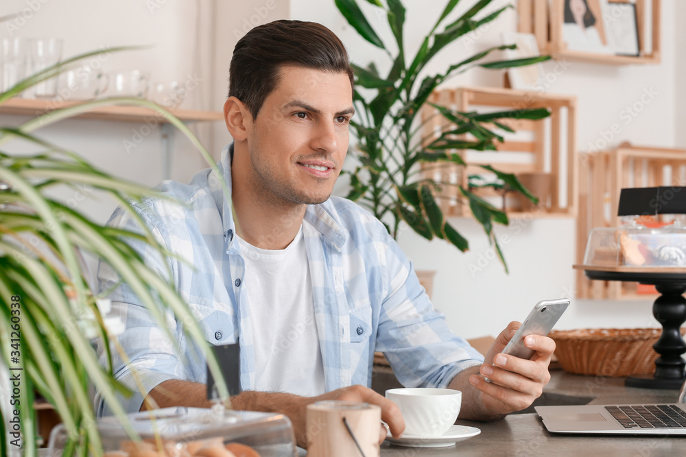 Business owner working in his cafe