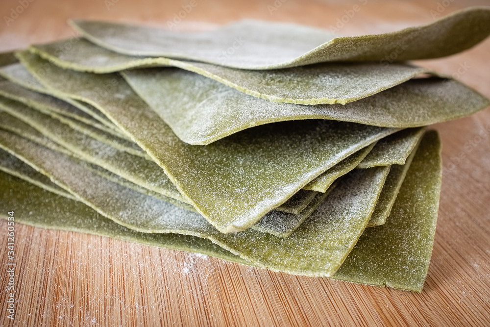 Stack of lasagna layers handmade with spinach Stack of lasagna layers handmade with spinach
