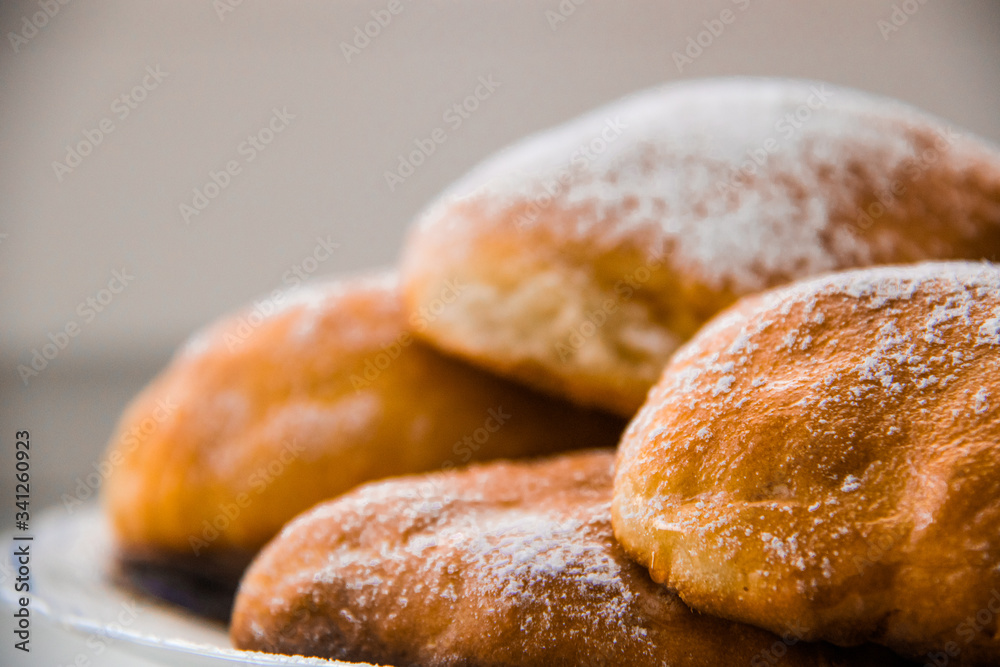 Delicate and fragrant buns prepared in a cozy house. Aesthetic food. Tasty snack. Fresh bakery.