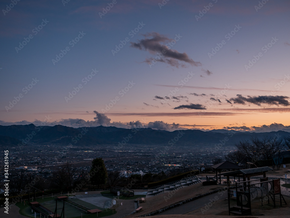 Views of Koufu city and the surrounding mountains at sunset
