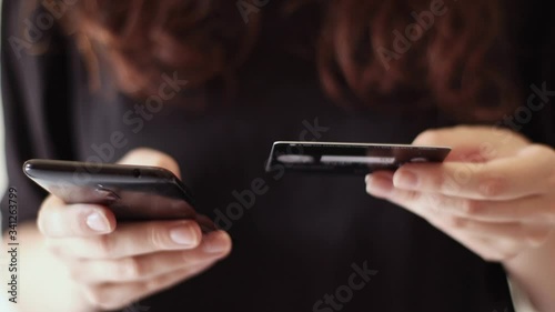 Woman pays for purchases over the Internet with a credit card
