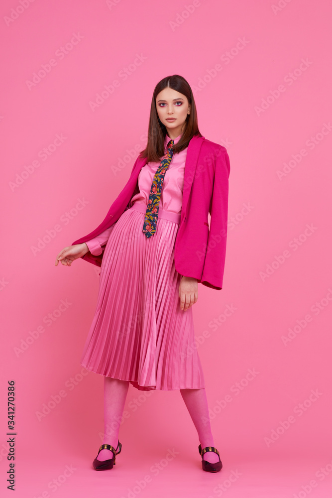 Fashion model in magenta jacket, pink skirt and shirt. Fashion model in magenta jacket, pink skirt and shirt.
