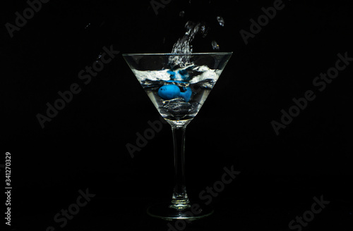 Cocktail glass and a splash of water 