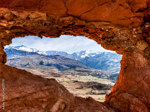 Unusual mountain view. View from the cave. Mountain landscape.