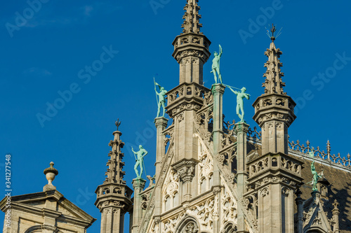 Statues on the roof of the Gothic Revival style Maison du Roi / Broodhuis building the Brabantine Gothic style facades on Grand Place in Brussels Belgium