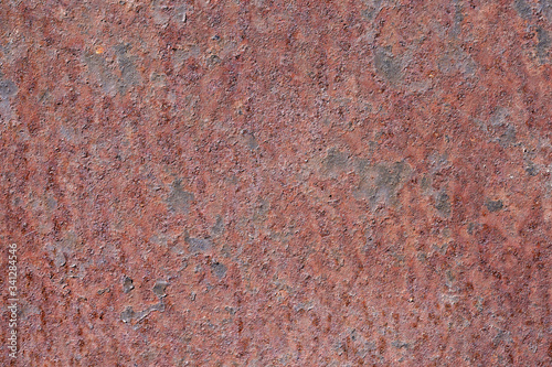 Oxidized metal surface, rust on iron surface, abstract rusty metal panel texture background.