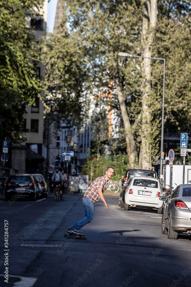 Man riding a skateboard in street