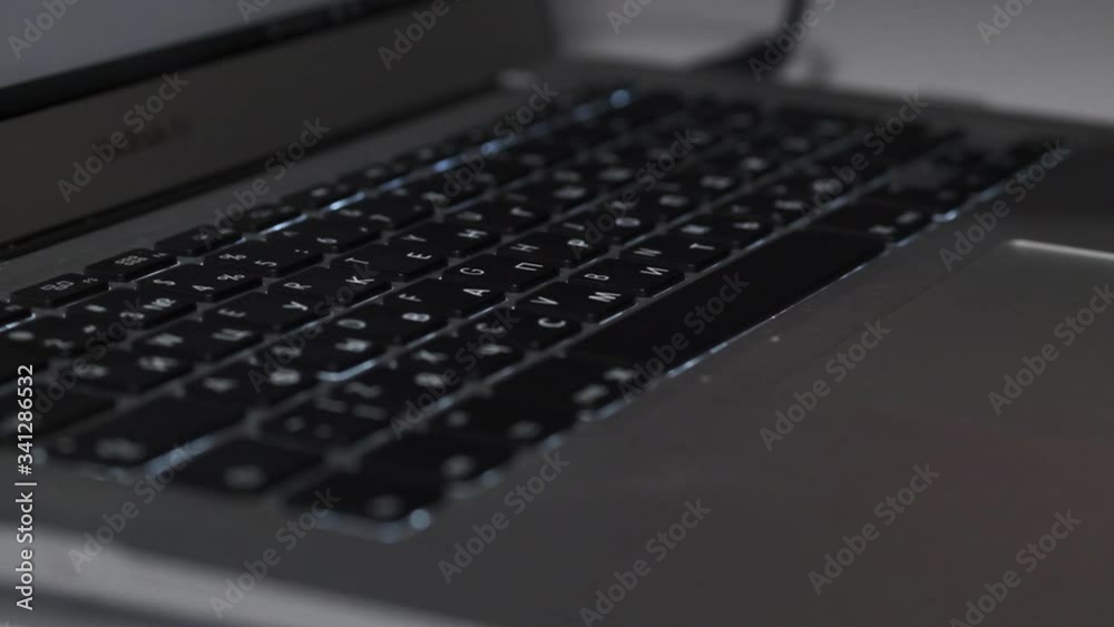 Hands typing on a laptop in slow motion Hands typing on a laptop in slow motion