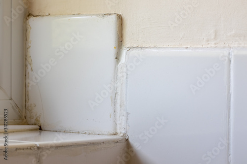 Bad tiling DIY disaster. Rogue trader or do-it-yourself fail.