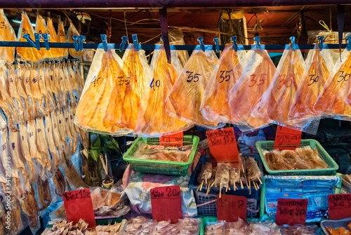 dried fish and dried squid in a street food night market in Bangkok, Thailand