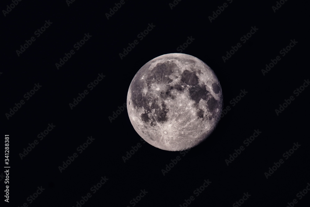 Close up detail of a full moon. The Full Worm Supermoon on March 9 of 2020. Barcelona,Spain Close up detail of a full moon. The Full Worm Supermoon on March 9 of 2020. Barcelona,Spain