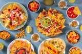 Mexican food variety, shot from above. Nachos, guacamole, tequila, tacos and other dishes, a flat lay