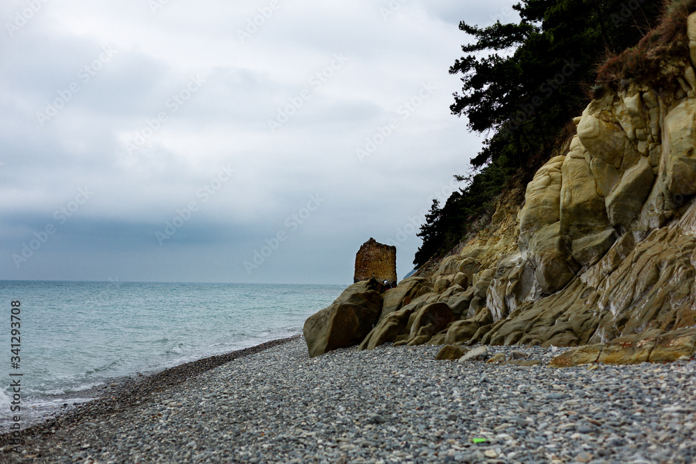 Stones beach at the sea in dark day