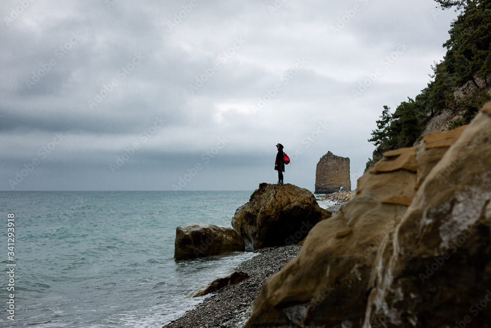 Stones beach at the sea in dark day