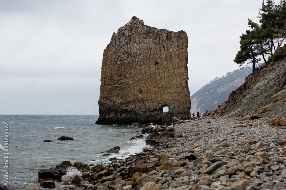 Stones beach at the sea in dark day